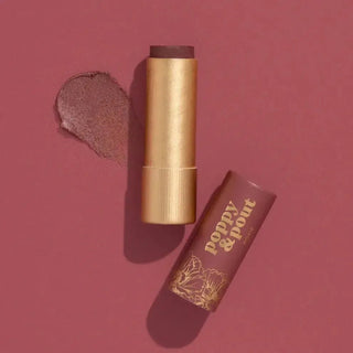 Roxie lip tint with 'Poppy & Post' branding on a red background