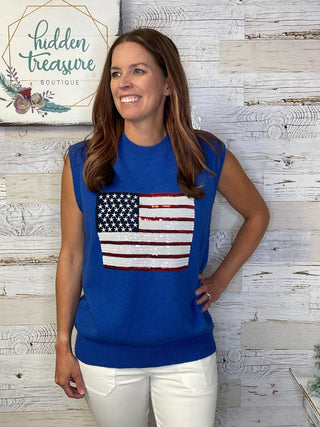 woman wearing a sleeveless American flag sweater top