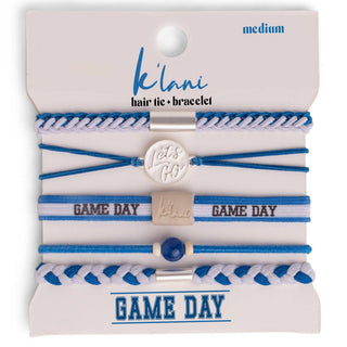 Set of blue and white hair ties and bracelets with 'Game Day' text on a 'Kilani' branded card.