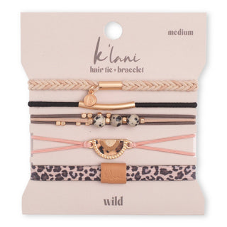 A set of eight K'lani hair tie and bracelet elastic bands on a beige cardboard display card. The collection features various patterns and colors including beige, black, brown, pink, leopard print, and metallic rose gold accents.