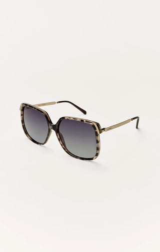 Sunglasses with black and gold frame on a white background