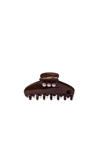 A glossy dark brown hair claw clip with three small pearl-like decorative accents on the front, shown against a plain white background.