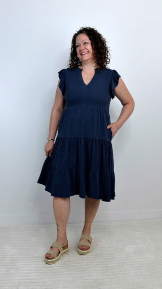 woman wearing a navy blue dress