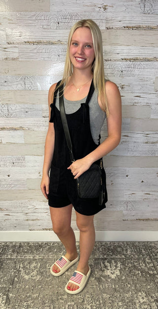 woman wearing a black romper