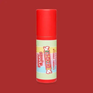 Smarties lip balm with red cap on a red background