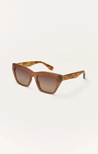 Brown sunglasses with gradient lenses on a white background
