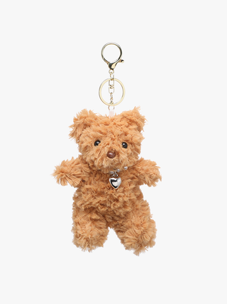 Brown teddy bear keychain with a heart tag on a white background