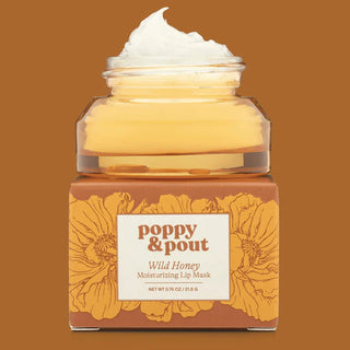 Jar of 'Poppy & Pout' Wild Honey Moisturizing Lip Mask on a brown background